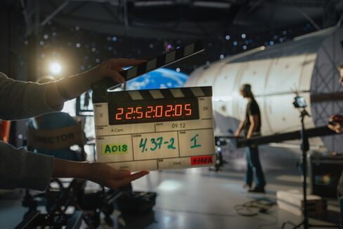 Director,Filming,Ad,Shoot,With,Astronaut,Fixing,Satellite.,Actor,Floats